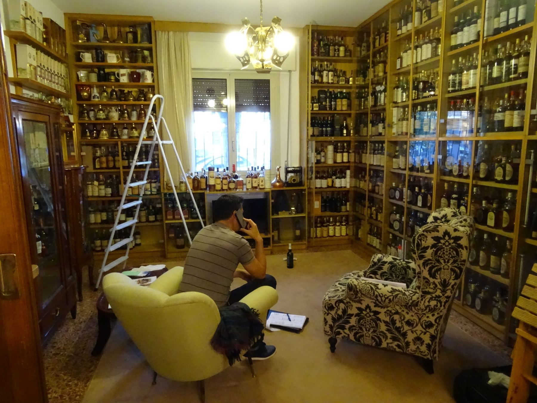 A room in Zagatti's house lined with shelves of bottles