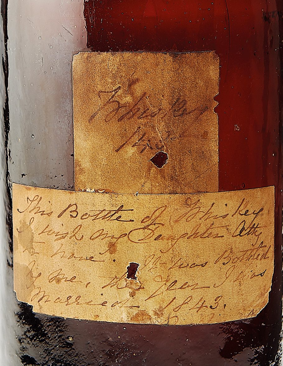 Close-up of the handwritten label on the 1843 bottle